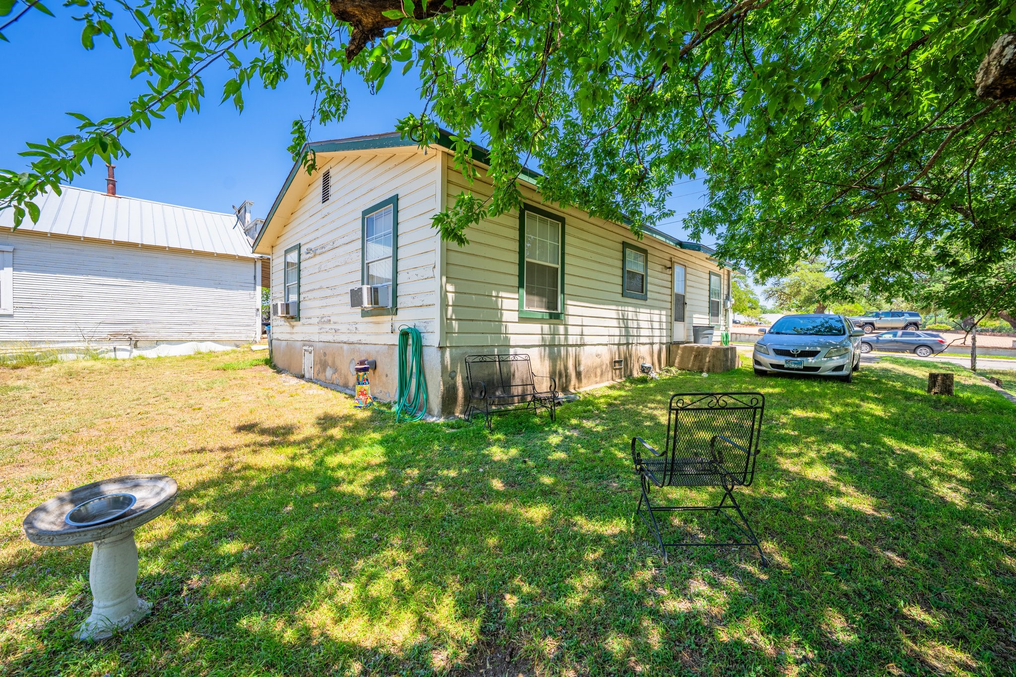 208 Francisco Lemos Street Kerrville, TX 78028 - Photo 20 of 29 a view of backyard of house with seating area