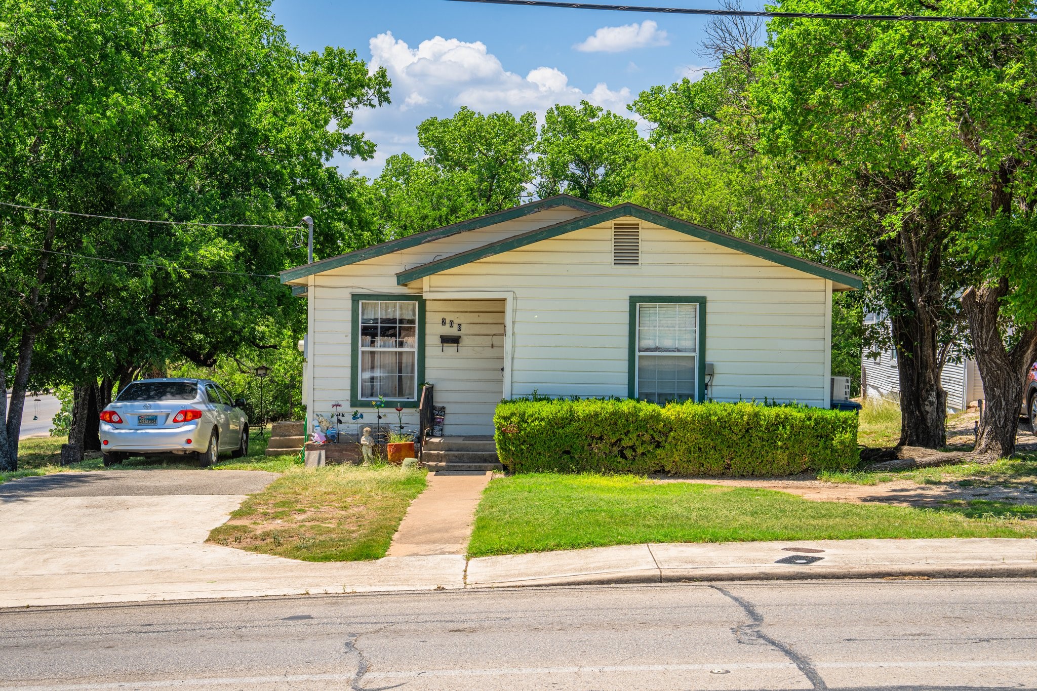 208 Francisco Lemos Street Kerrville, TX 78028 - Photo 2 of 29 a front view of a house with a yard