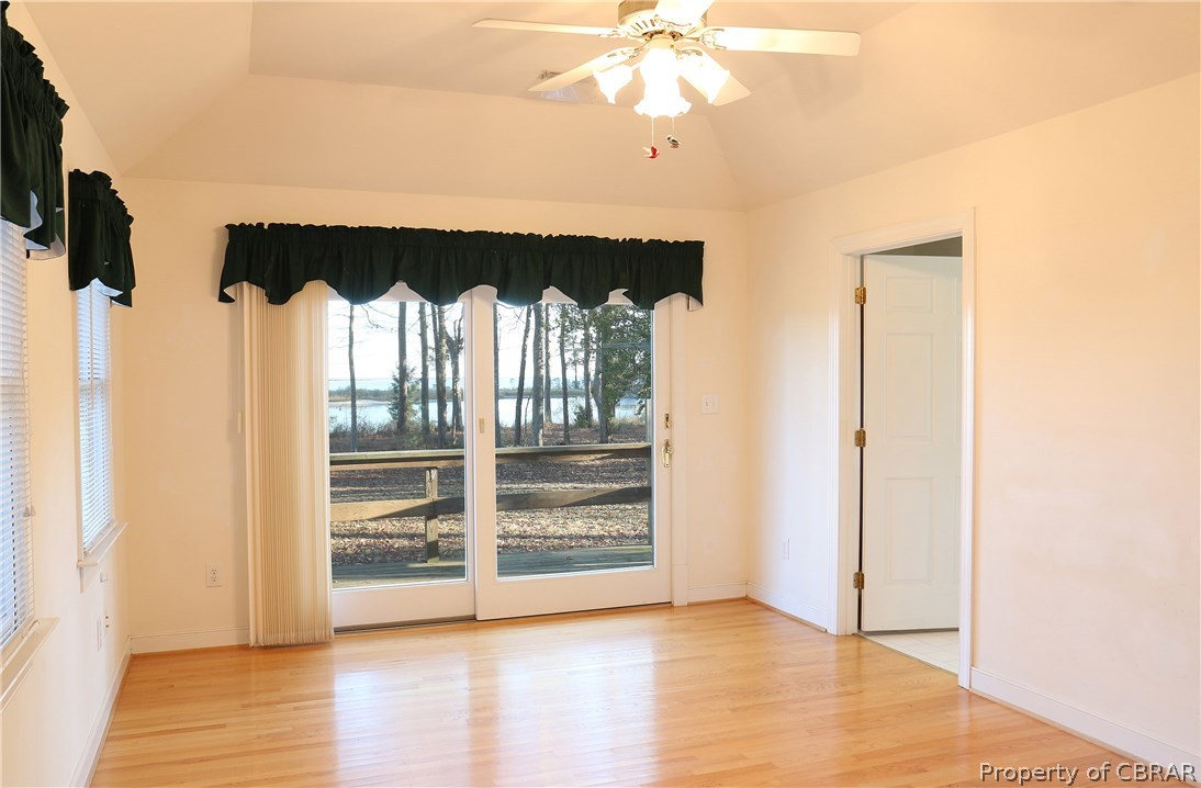 97 Barnes View Lane Kilmarnock, VA 22482 - Photo 11 of 20 Master suite with vaulted ceiling, huge master bath to the right. Deck off this room to relax and enjoy the view.