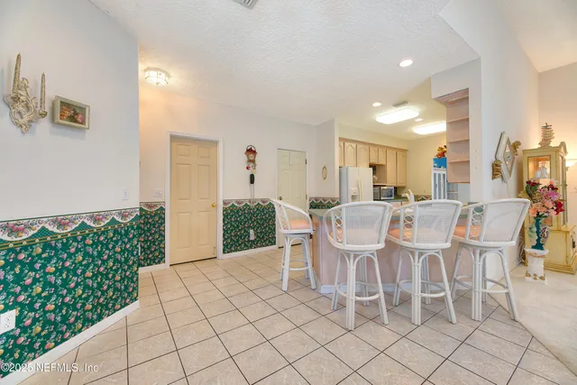a kitchen with stainless steel appliances a stove a sink and a microwave