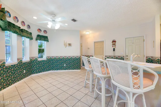 a large kitchen with stainless steel appliances granite countertop a sink and cabinets