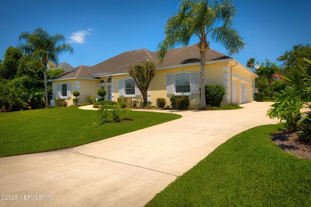 a front view of house with yard and green space