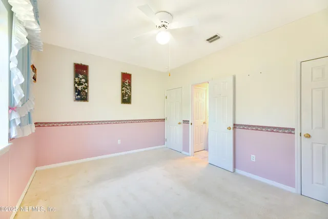 a backyard of a house with yard and outdoor seating