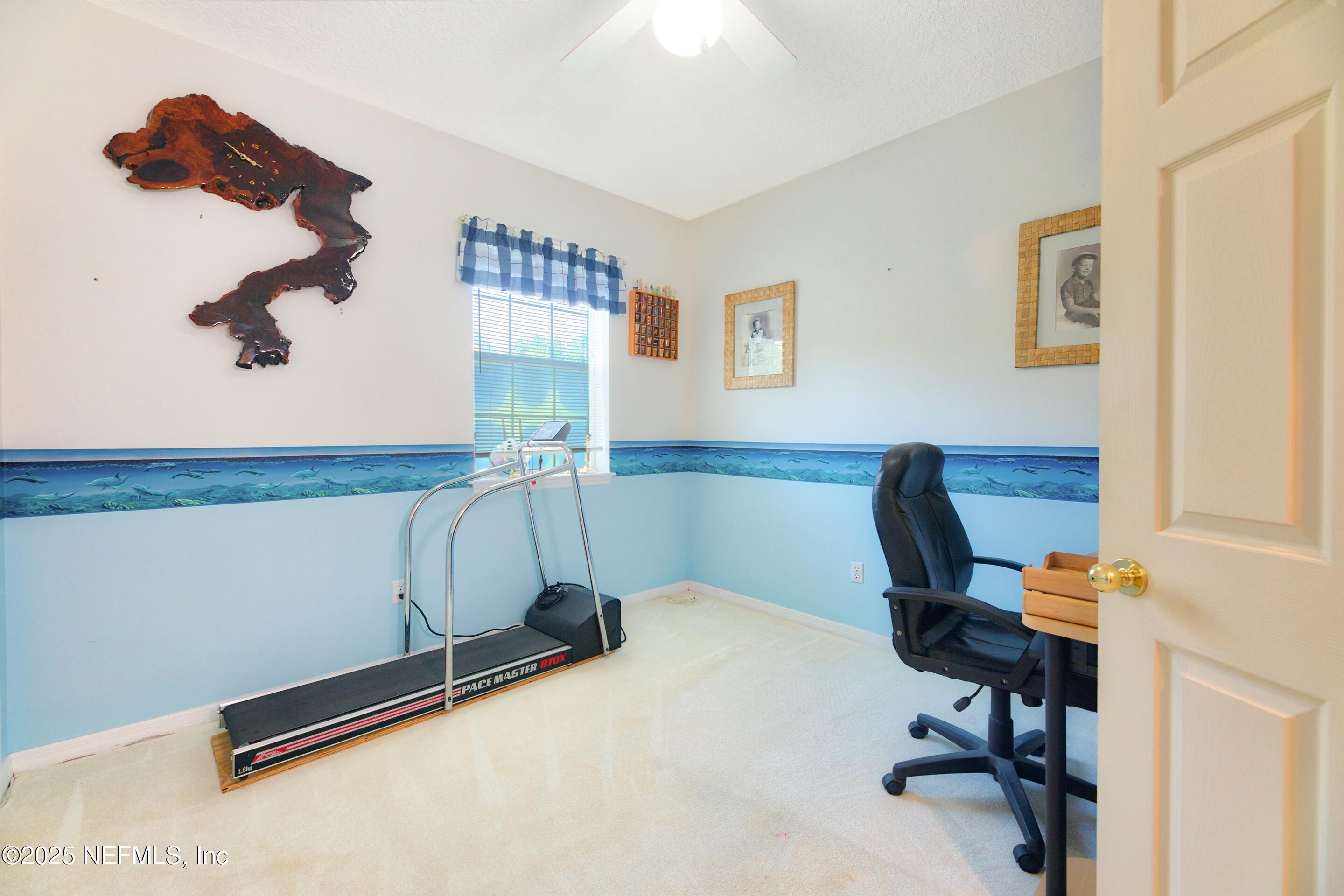 430 Marsh Point Circle St. Augustine, FL 32080 - Photo 39 of 69 a room with gym equipment and a window