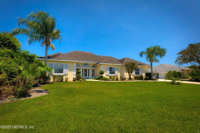 a front view of a house with a garden and porch