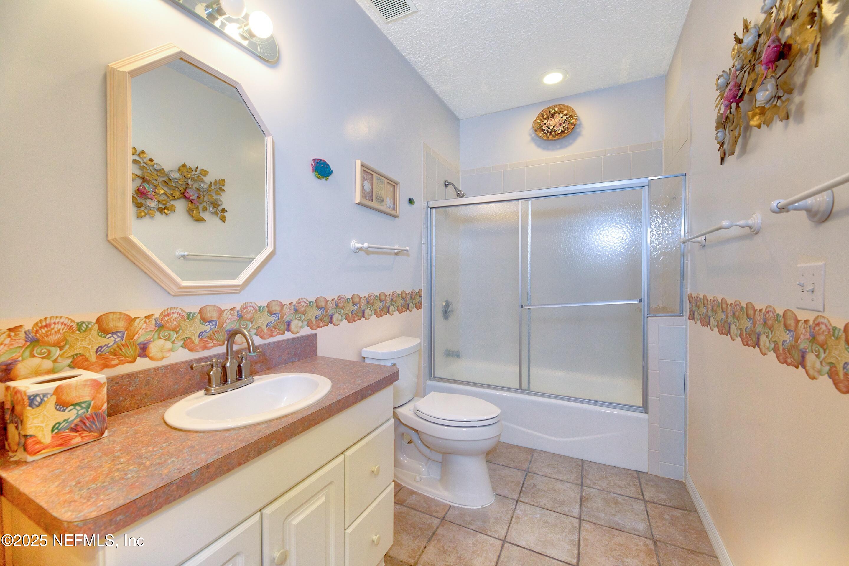 430 Marsh Point Circle St. Augustine, FL 32080 - Photo 43 of 69 a bathroom with a sink toilet and shower