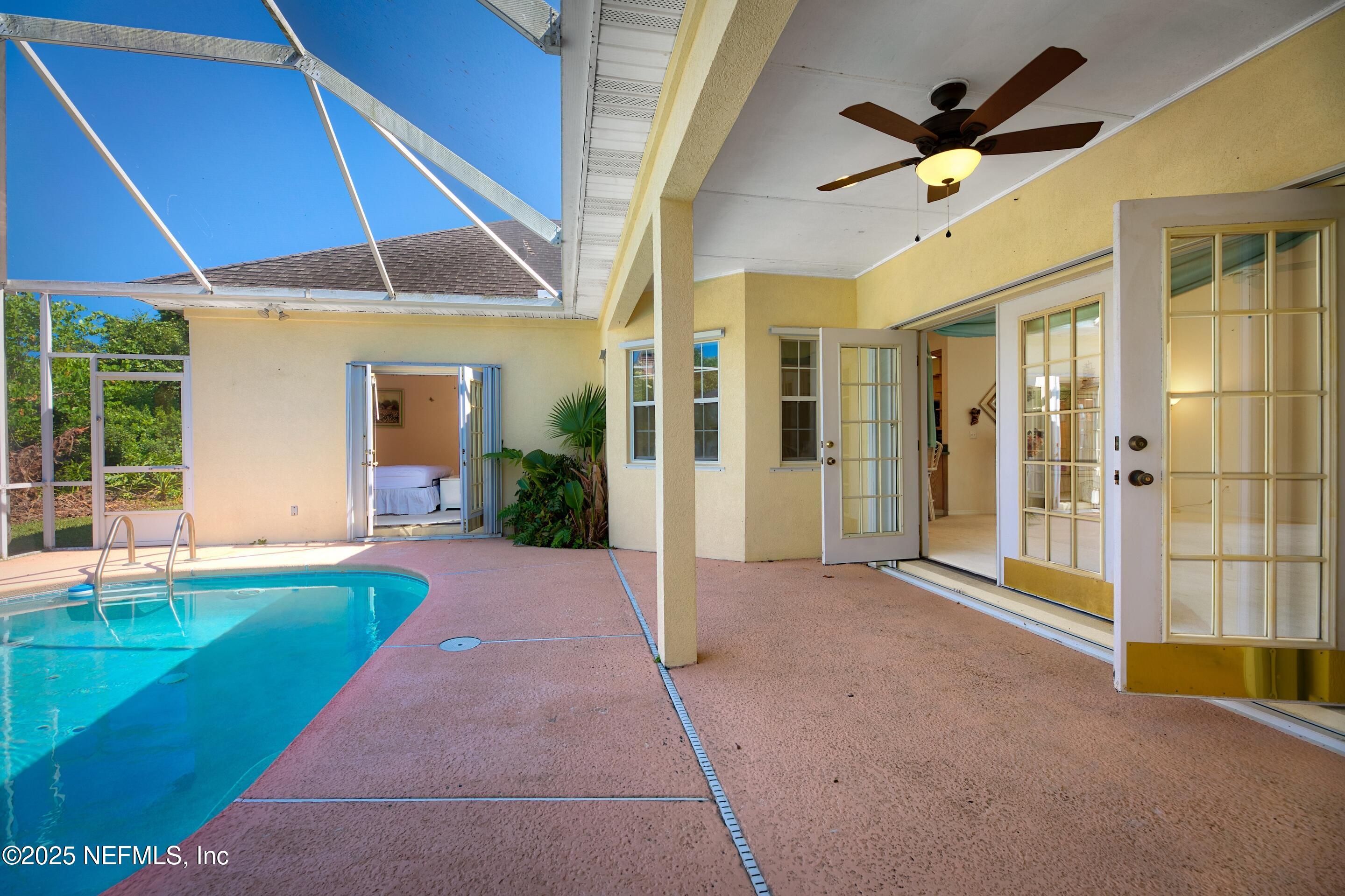 430 Marsh Point Circle St. Augustine, FL 32080 - Photo 44 of 69 a view of a patio with a table and chairs under an umbrella