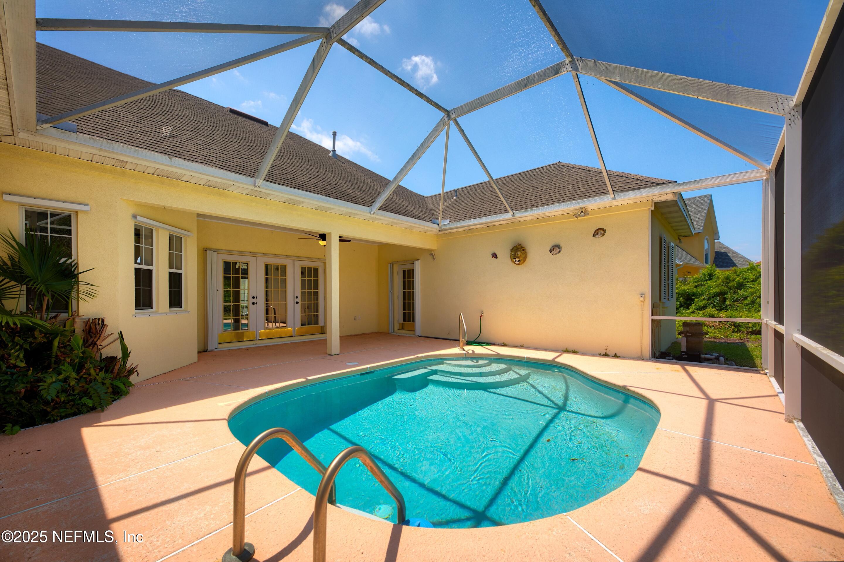 430 Marsh Point Circle St. Augustine, FL 32080 - Photo 46 of 69 a backyard of a house with yard and outdoor seating