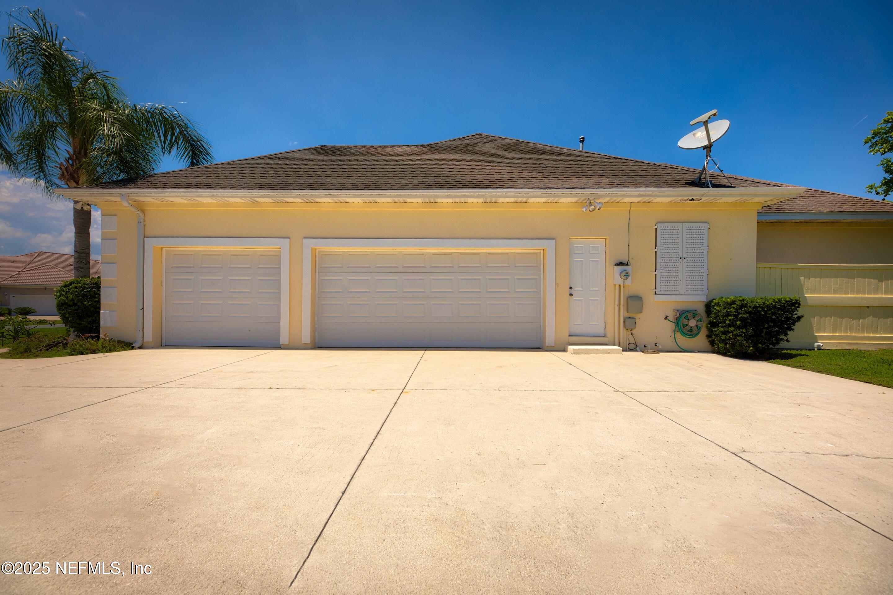 430 Marsh Point Circle St. Augustine, FL 32080 - Photo 5 of 69 a front view of a house with a yard and garage