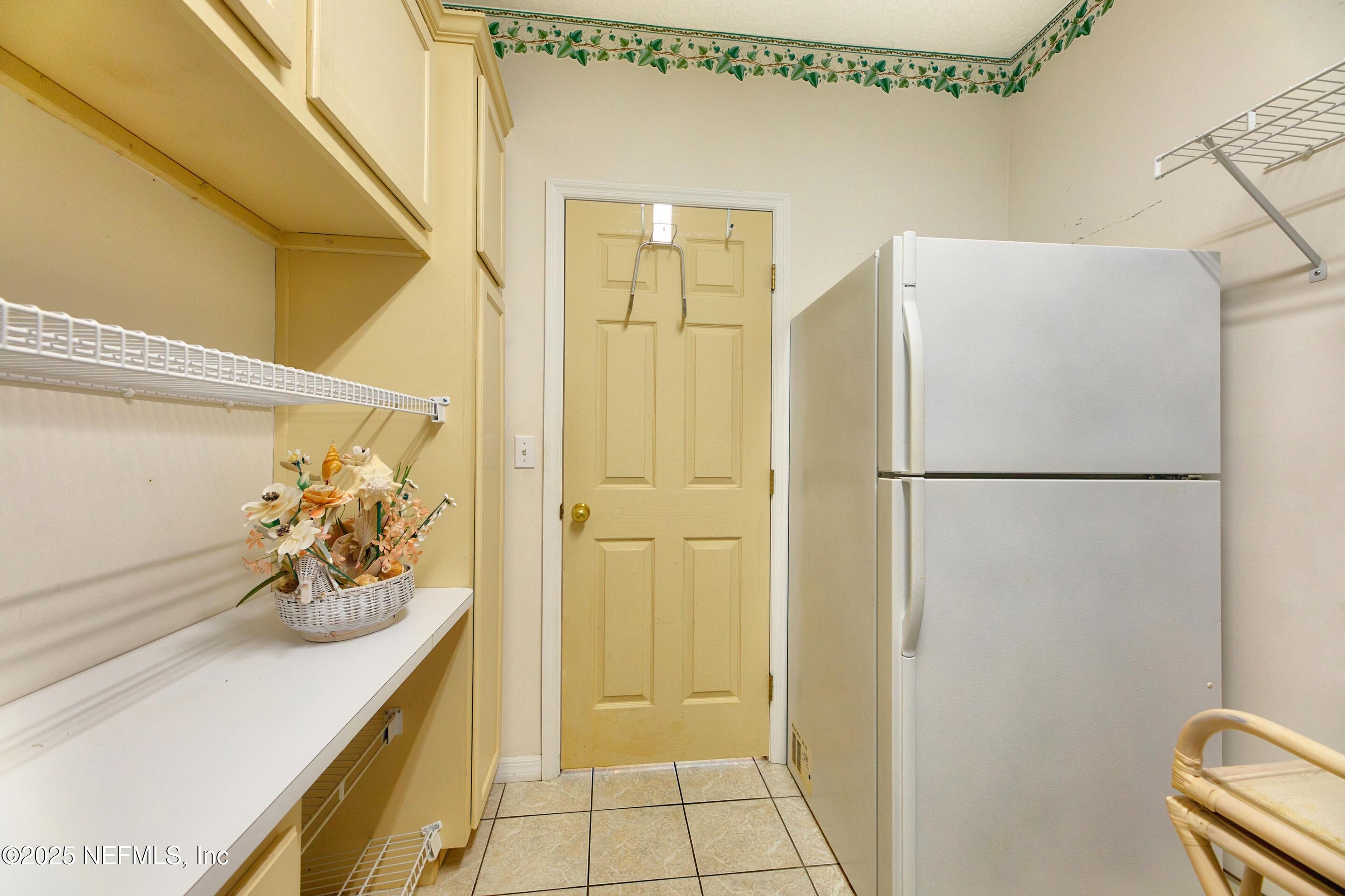 430 Marsh Point Circle St. Augustine, FL 32080 - Photo 54 of 69 a bathroom with a granite countertop shower a sink and a mirror