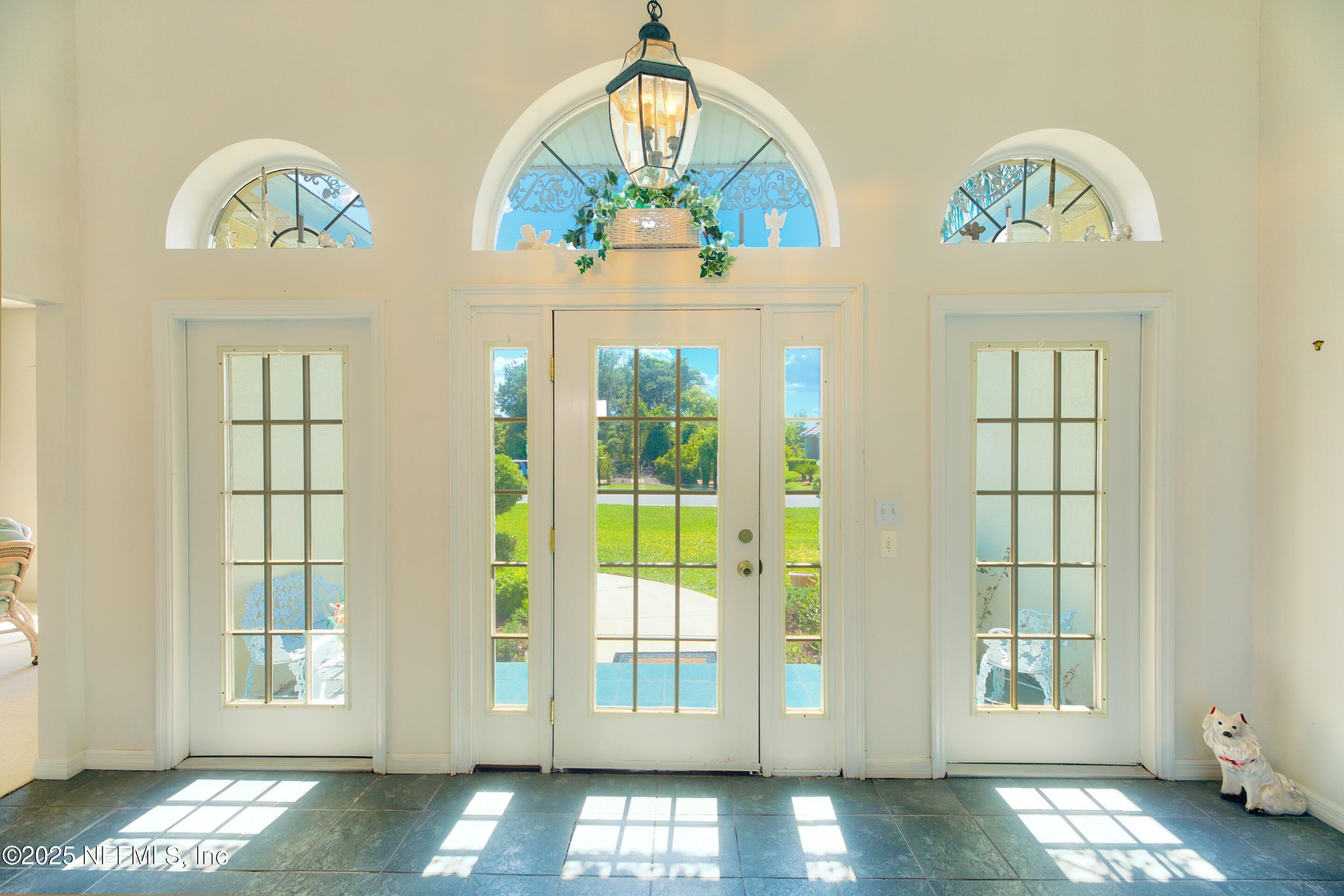 430 Marsh Point Circle St. Augustine, FL 32080 - Photo 8 of 69 a view of an entryway with wooden floor