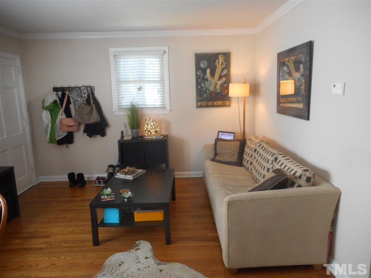 2306 Bernard Street, Unit 2306 Raleigh, NC 27608 - Photo 3 of 13 Living Area with Hardwoods and Crown Molding