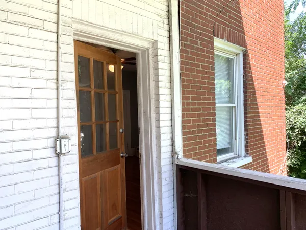 a view of a door and a window