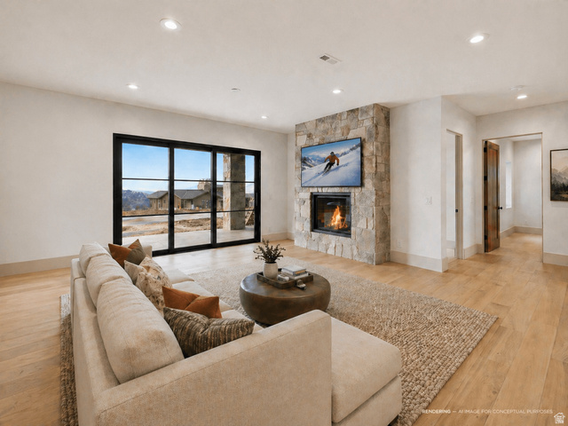 2155 East Wrangler Road Kamas, UT 84036 - Photo 9 of 62 Living room featuring light wood finished floors, a fireplace, and recessed lighting