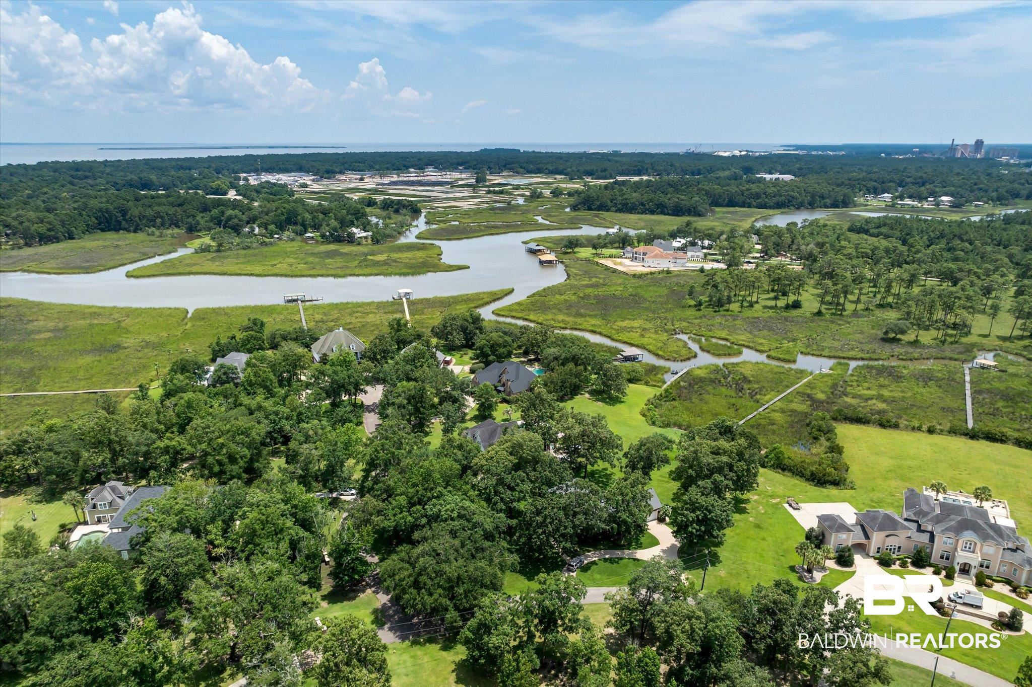 2905 Riverview Pointe Drive South Theodore, AL 36582 - Photo 34 of 44 Aerial view of property's location with a nearby body of water and nearby suburban area