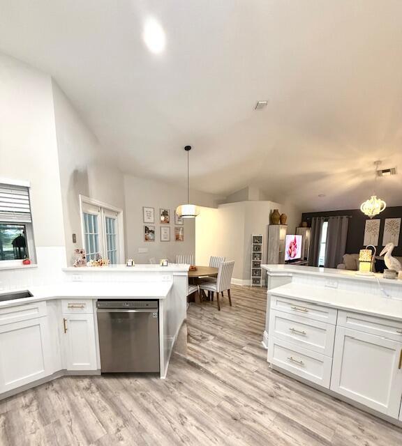 22392 Siesta Key Drive Boca Raton, FL 33428 - Photo 13 of 39 a living room with kitchen island furniture and a kitchen view