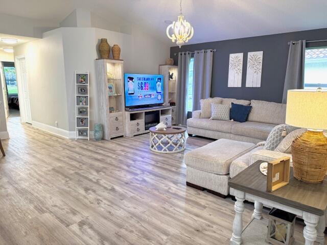 22392 Siesta Key Drive Boca Raton, FL 33428 - Photo 15 of 39 a living room with furniture a fireplace and a flat screen tv