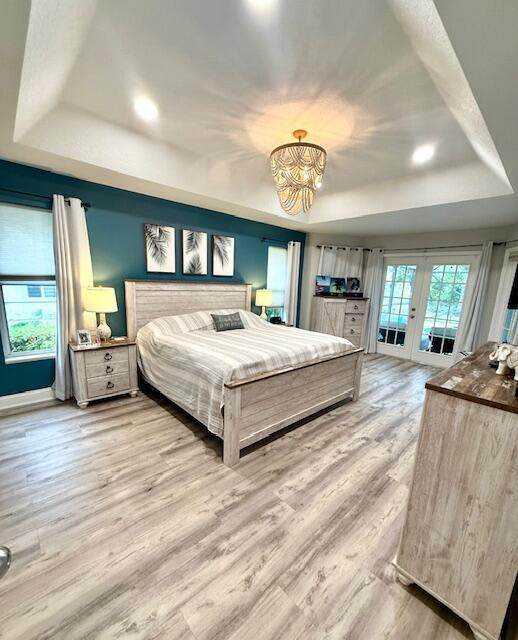 22392 Siesta Key Drive Boca Raton, FL 33428 - Photo 16 of 39 a bedroom with a large bed and a large dresser