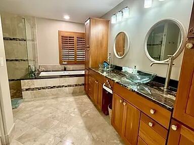 22392 Siesta Key Drive Boca Raton, FL 33428 - Photo 18 of 39 a bathroom with a granite countertop sink a mirror and a shower