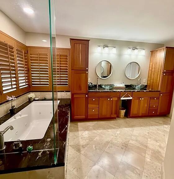 22392 Siesta Key Drive Boca Raton, FL 33428 - Photo 19 of 39 a bathroom with a sink a vanity and a large mirror