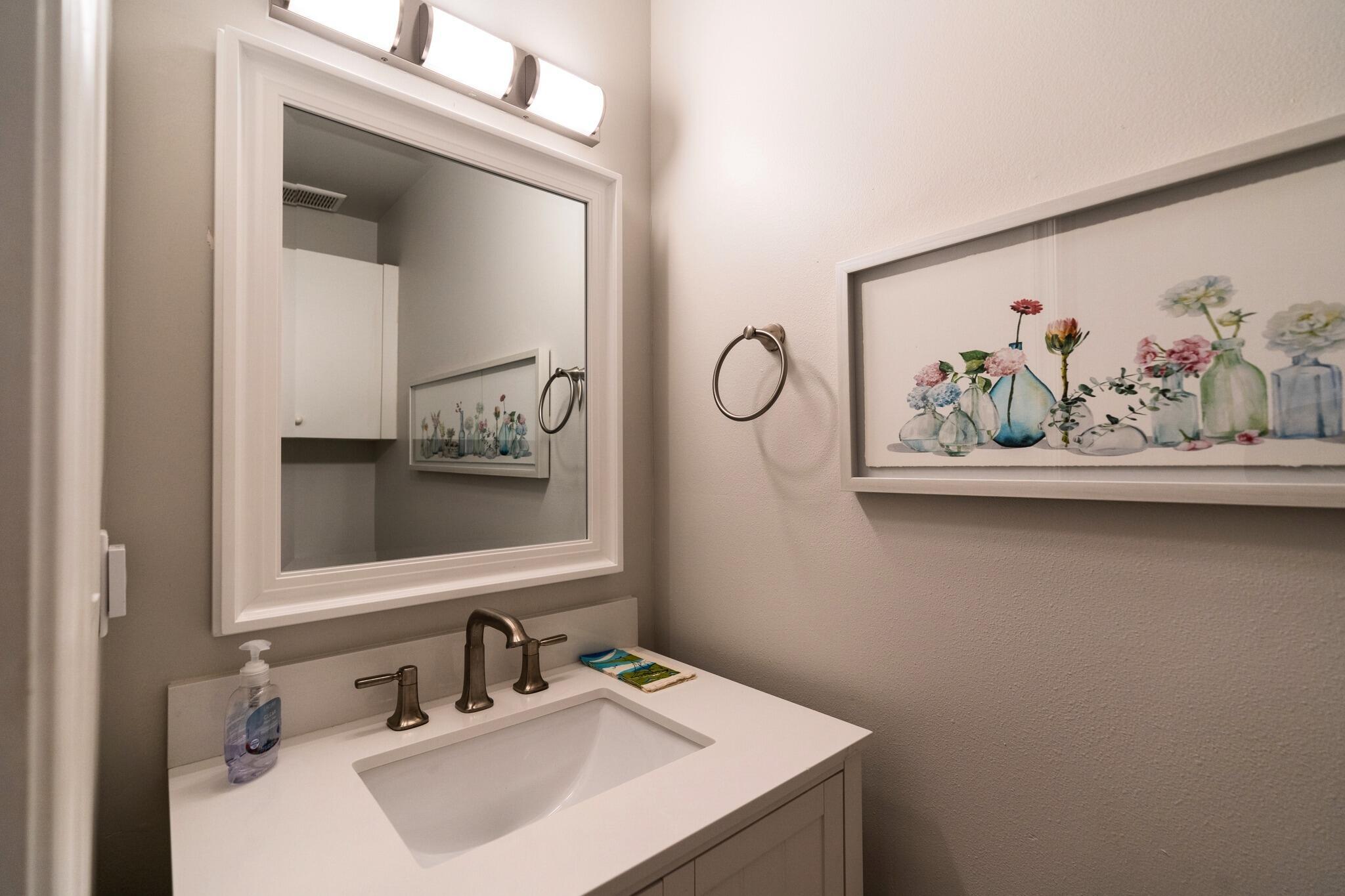 22392 Siesta Key Drive Boca Raton, FL 33428 - Photo 26 of 39 a bathroom with a sink and a mirror
