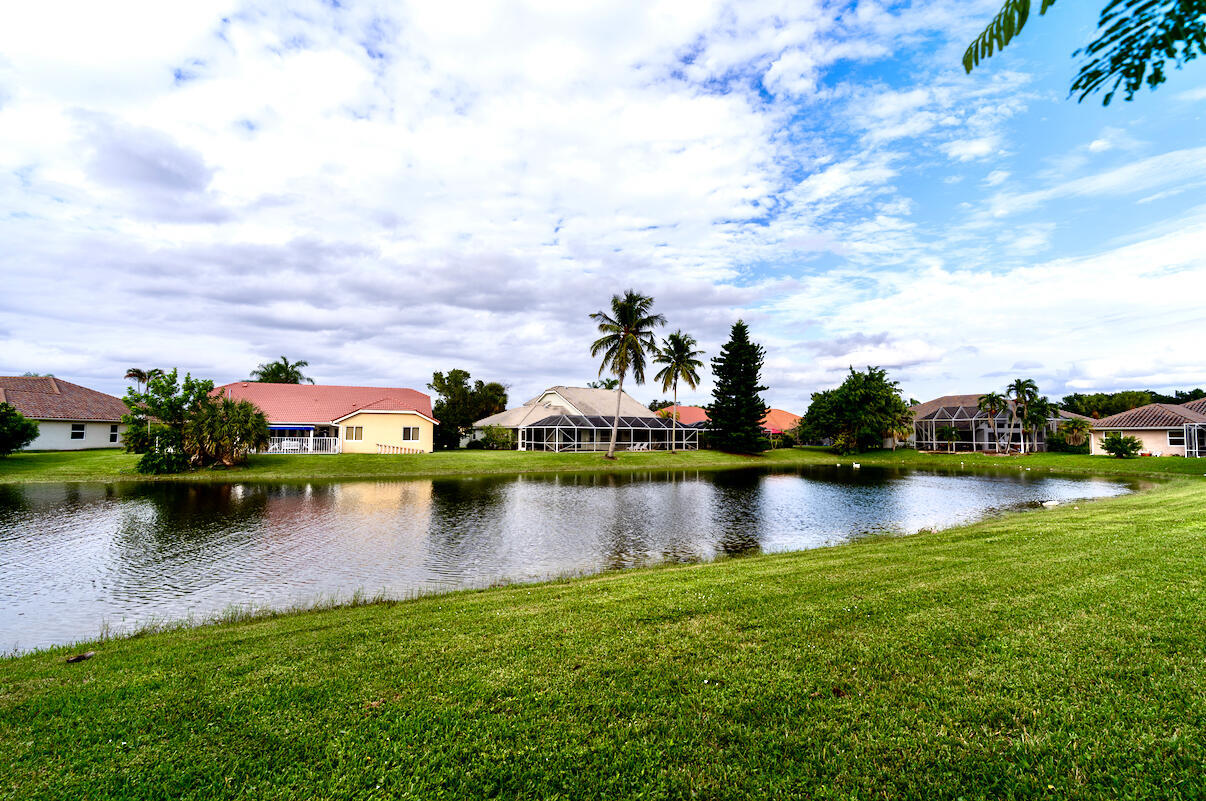 22392 Siesta Key Drive Boca Raton, FL 33428 - Photo 32 of 39 a view of a lake in front of house
