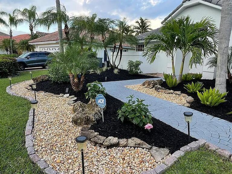 22392 Siesta Key Drive Boca Raton, FL 33428 - Photo 5 of 39 a view of a garden with a flower garden