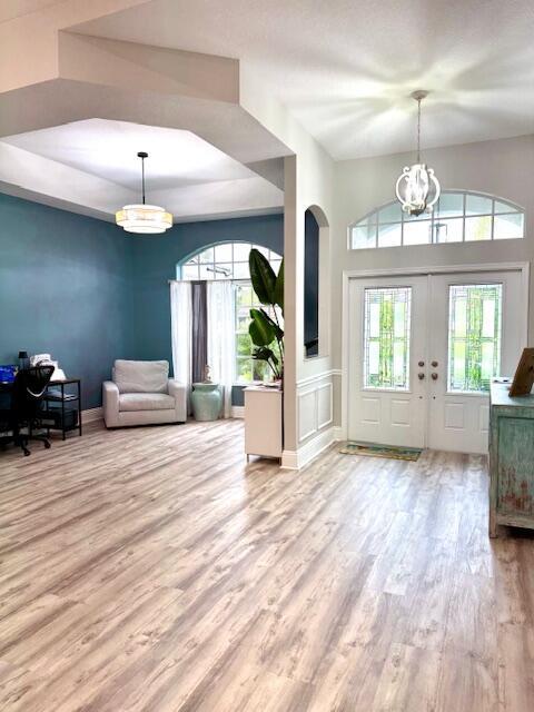 22392 Siesta Key Drive Boca Raton, FL 33428 - Photo 9 of 39 a view of a livingroom with furniture wooden floor and a chandelier