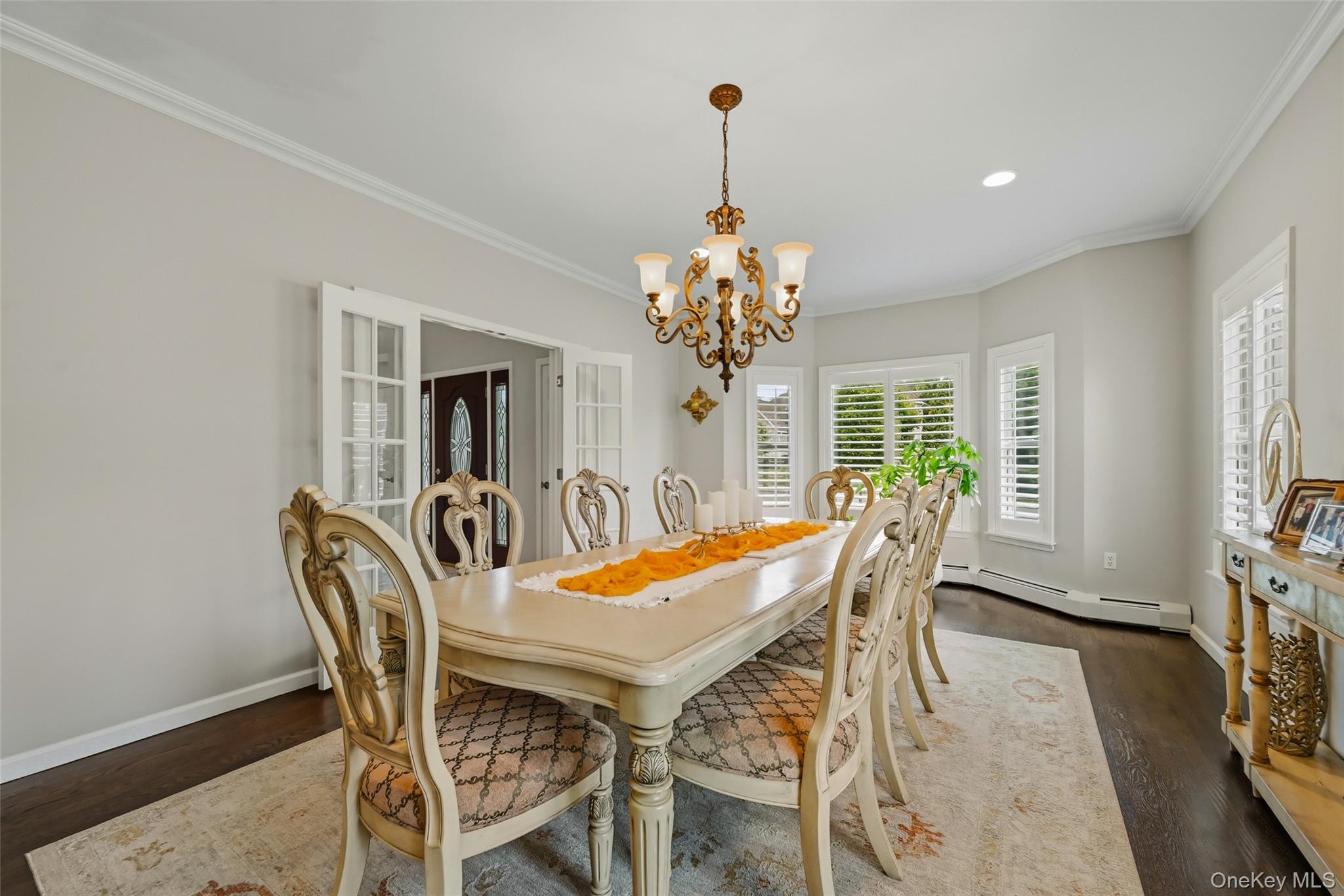 51 Meriwether Trail Congers, NY 10920 - Photo 7 of 50 Dining area featuring dark wood-finish flooring, light walls, and white crown molding