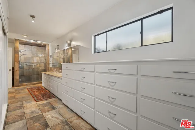 a view of a house with pool yard and a yard