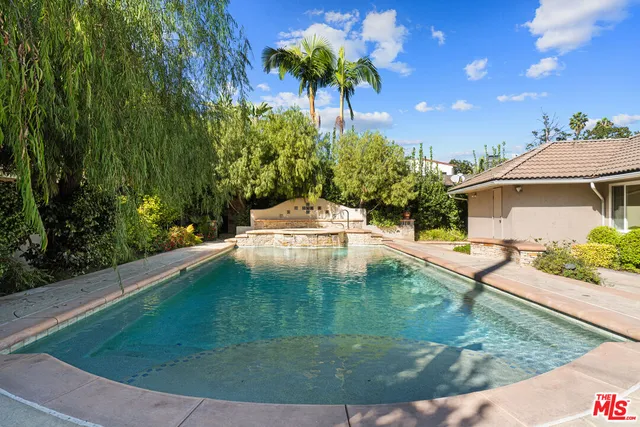 an aerial view of residential houses with outdoor space and street view