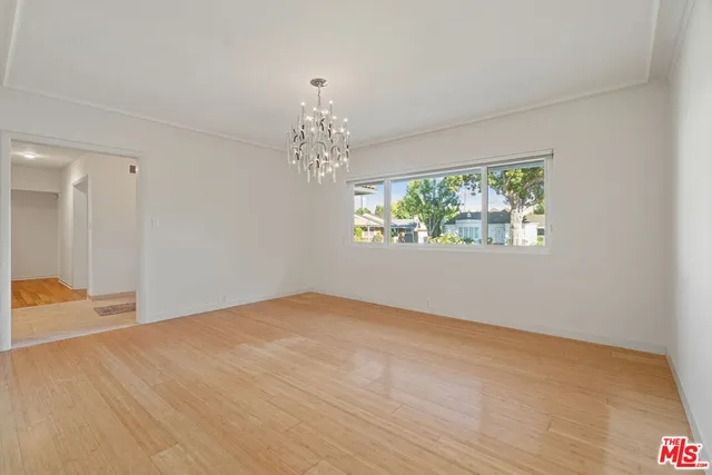 a kitchen with a stove a sink and a refrigerator