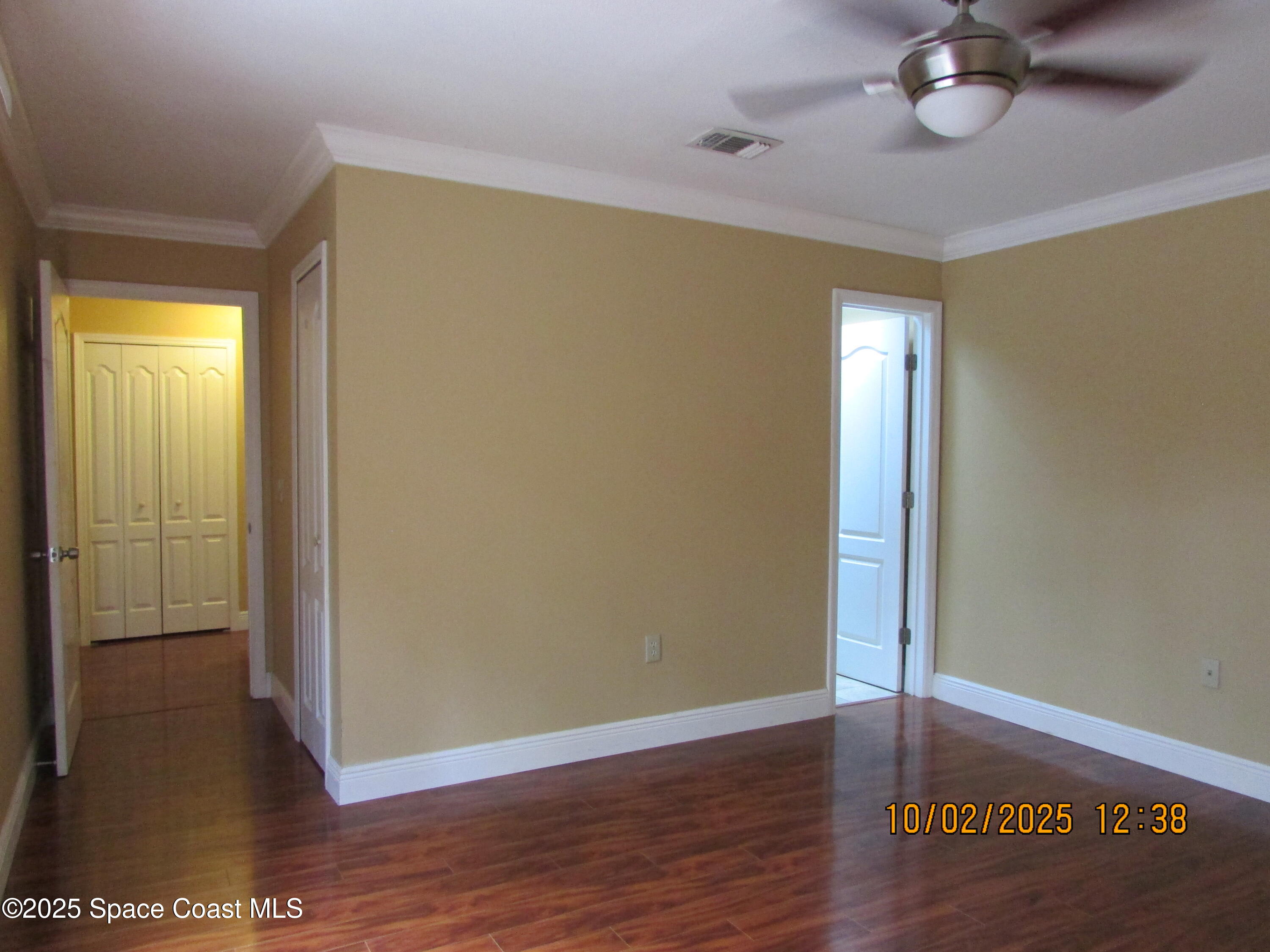49 Piney Branch Way, Unit A Melbourne, FL 32904 - Photo 13 of 25 a view of a room with wooden floor