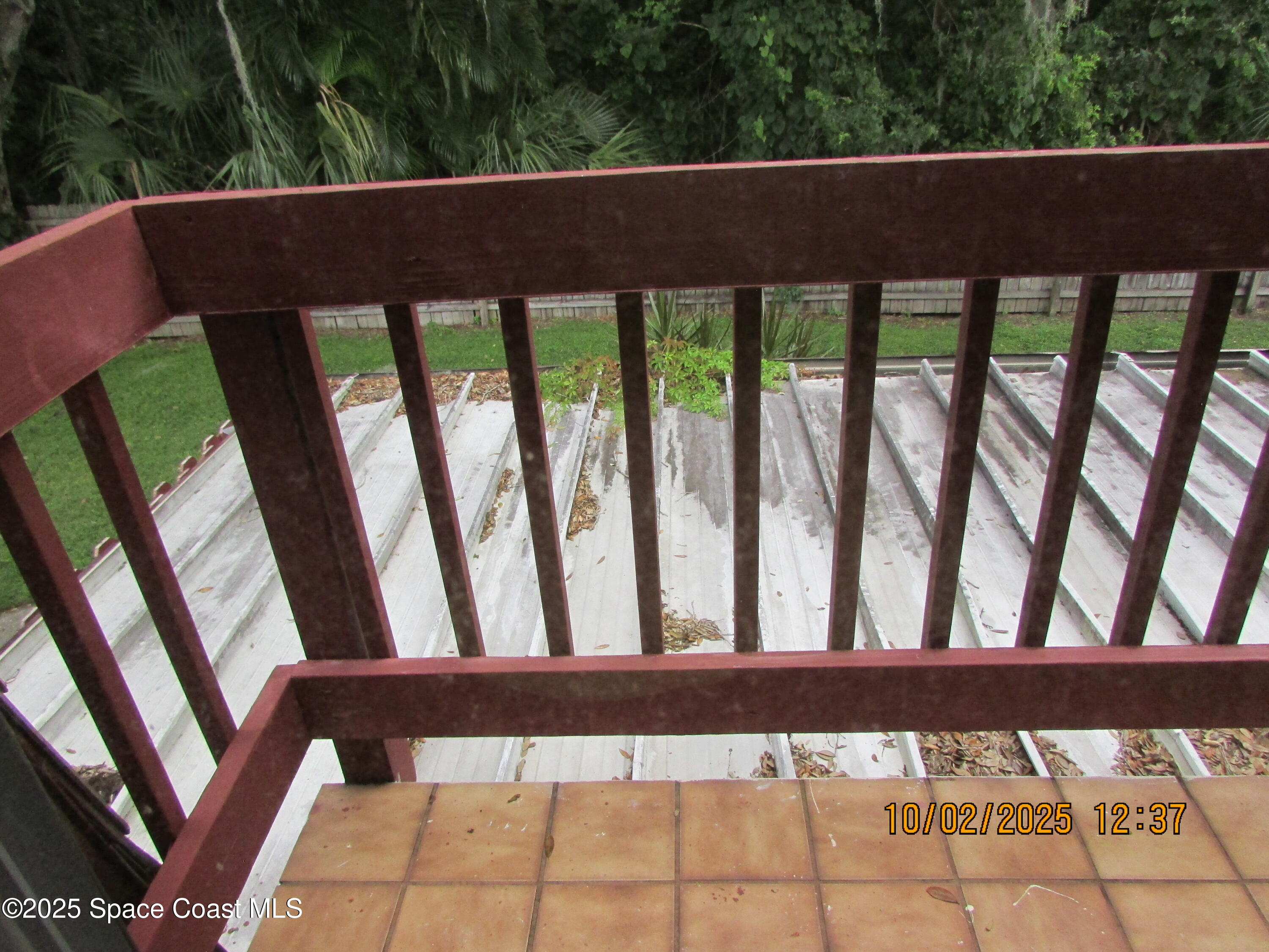 49 Piney Branch Way, Unit A Melbourne, FL 32904 - Photo 22 of 25 a view of balcony with wooden floor