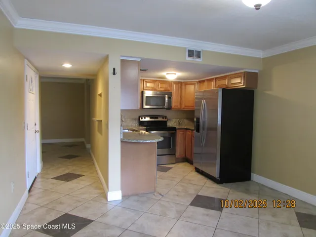 a view of an entryway with a hallway