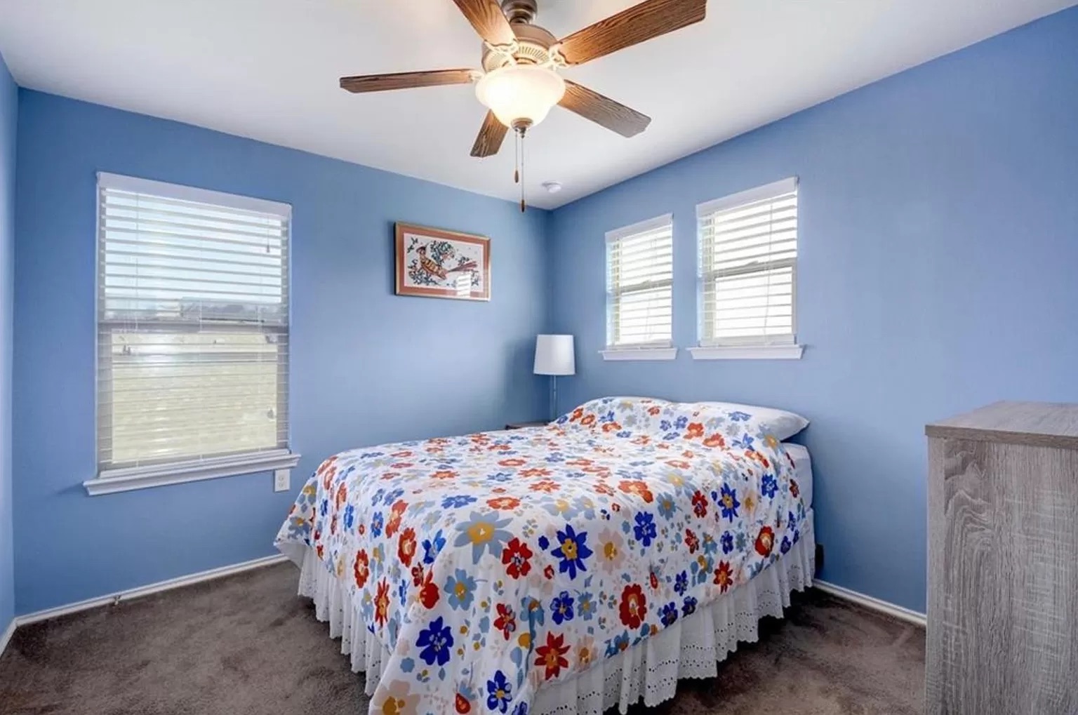 9016 Ridgewell Road Austin, TX 78747 - Photo 18 of 30 A comforting bedroom space featuring practical window blinds and a ceiling fan for year-round comfort.