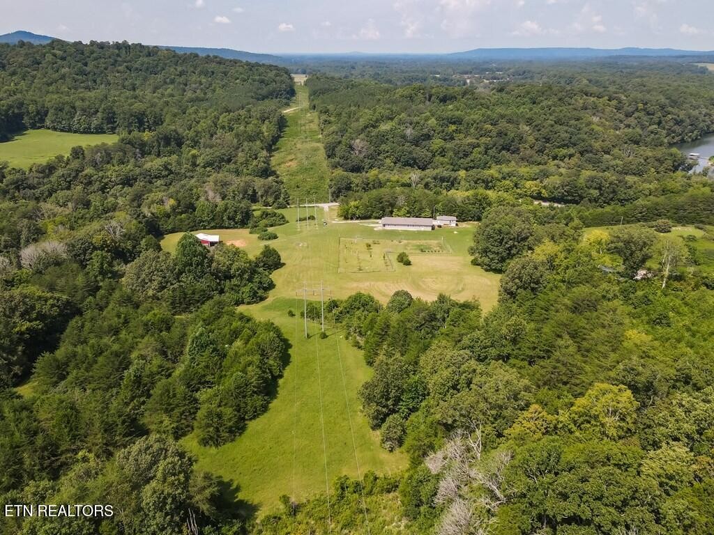1518 Cummingsville And Sparkman Road Doyle, TN 38559 - Photo 5 of 58 a view of a lake with an outdoor space