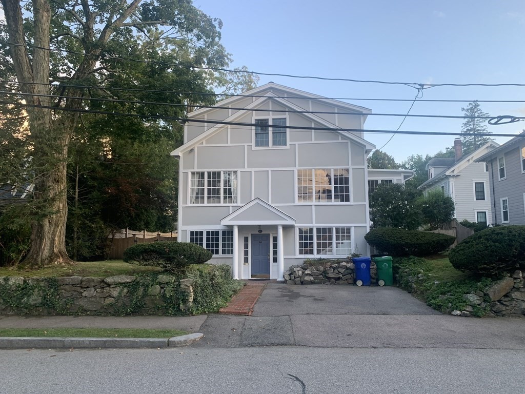 62 Pleasant Street Newton, MA 02459 - Photo 1 of 17 a front view of a house with a garden