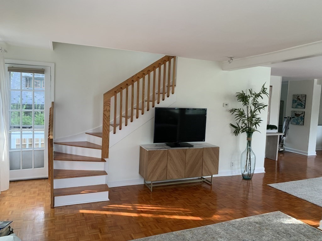 62 Pleasant Street Newton, MA 02459 - Photo 12 of 17 a living room with furniture and a flat screen tv