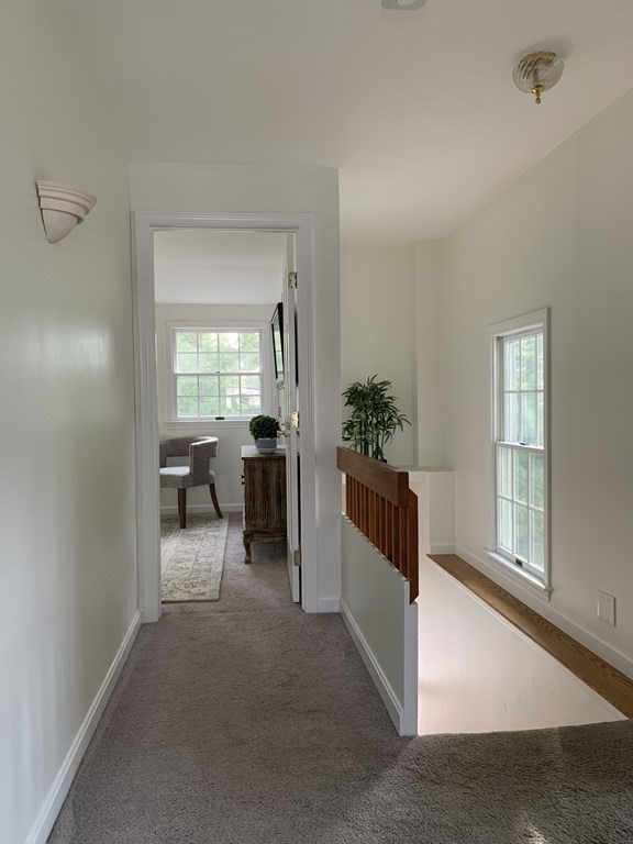 62 Pleasant Street Newton, MA 02459 - Photo 13 of 17 a view of a livingroom with furniture and a window