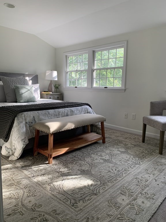 62 Pleasant Street Newton, MA 02459 - Photo 14 of 17 a bed sitting in a bedroom next to a window