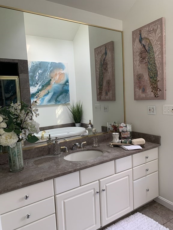 62 Pleasant Street Newton, MA 02459 - Photo 15 of 17 a bathroom with sink and mirror