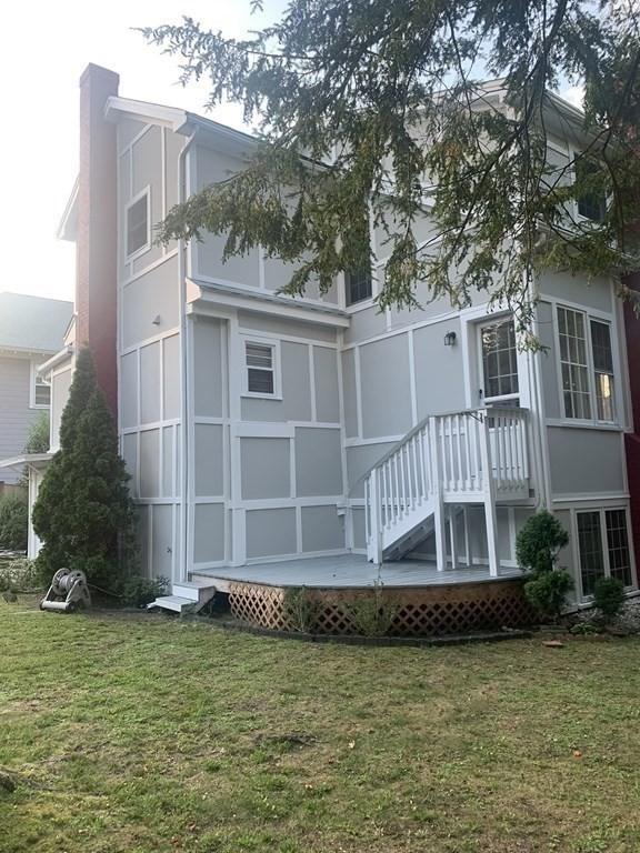 62 Pleasant Street Newton, MA 02459 - Photo 17 of 17 a front view of a house with a yard