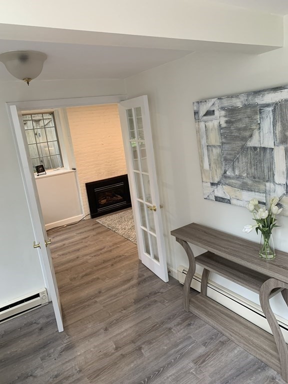 62 Pleasant Street Newton, MA 02459 - Photo 2 of 17 a living room with furniture and a wooden floor