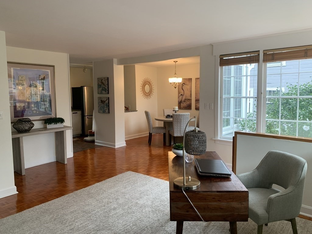 62 Pleasant Street Newton, MA 02459 - Photo 7 of 17 a living room with furniture wooden floor and a large window