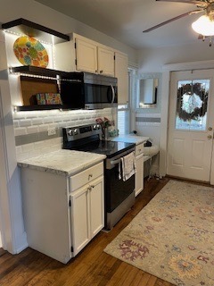 3 East Slade Street Palatine, IL 60067 - Photo 18 of 45 a kitchen with stainless steel appliances a stove a microwave and a hard wood floor