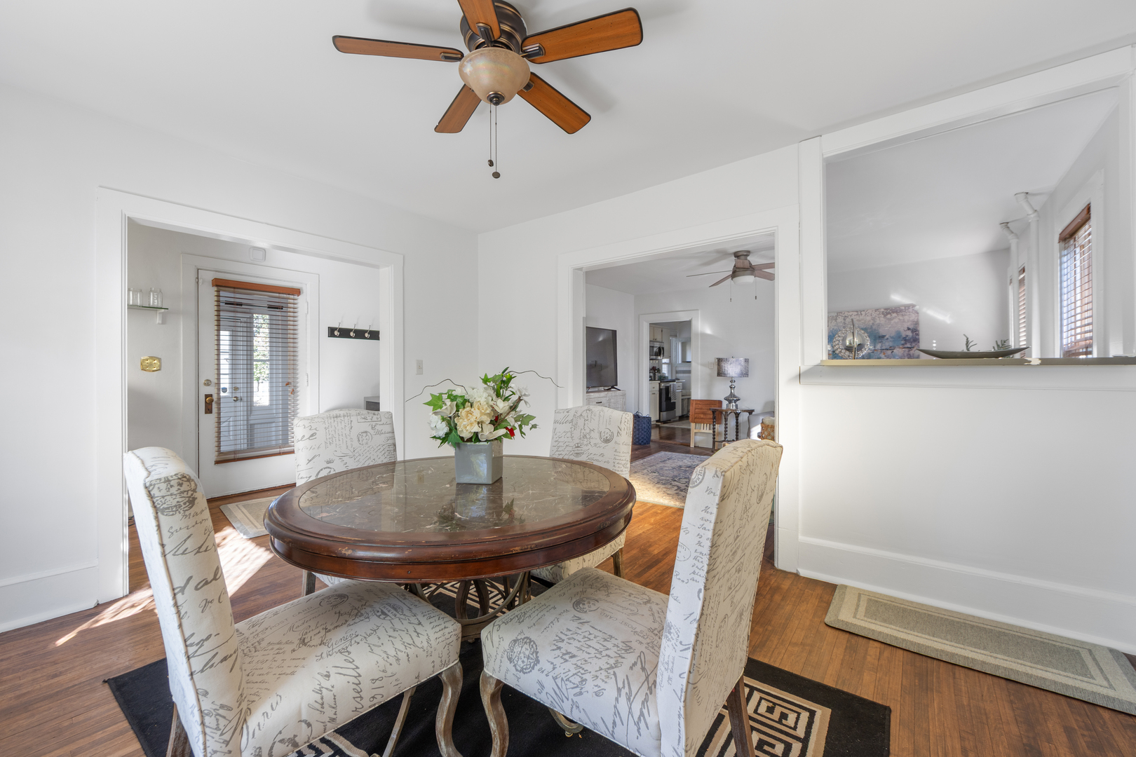 3 East Slade Street Palatine, IL 60067 - Photo 9 of 45 a view of a dining room with furniture and a chandelier fan