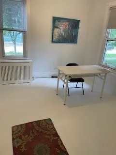 a living room with hardwood floor and flat screen tv