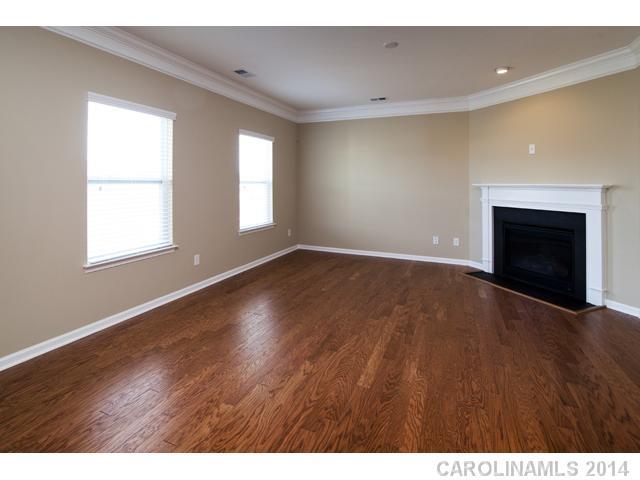 79369 Ridgehaven Road, Unit 26 Lancaster, SC 29720 - Photo 4 of 16 a view of an empty room with window and wooden floor