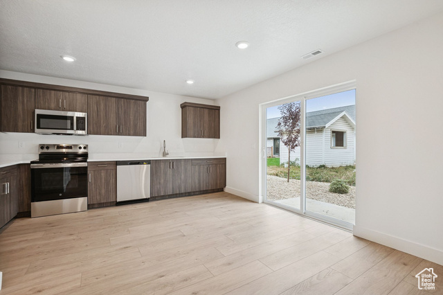 1615 North Angel Street, Unit H Layton, UT 84041 - Photo 18 of 55 Kitchen featuring stainless steel appliances, dark brown cabinetry, modern cabinets, light wood finished floors, and recessed lighting